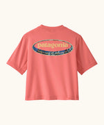 Patagonia's little kids capeline short sleeve t-shirt in bright pink with large oval logo graphic on upper back 