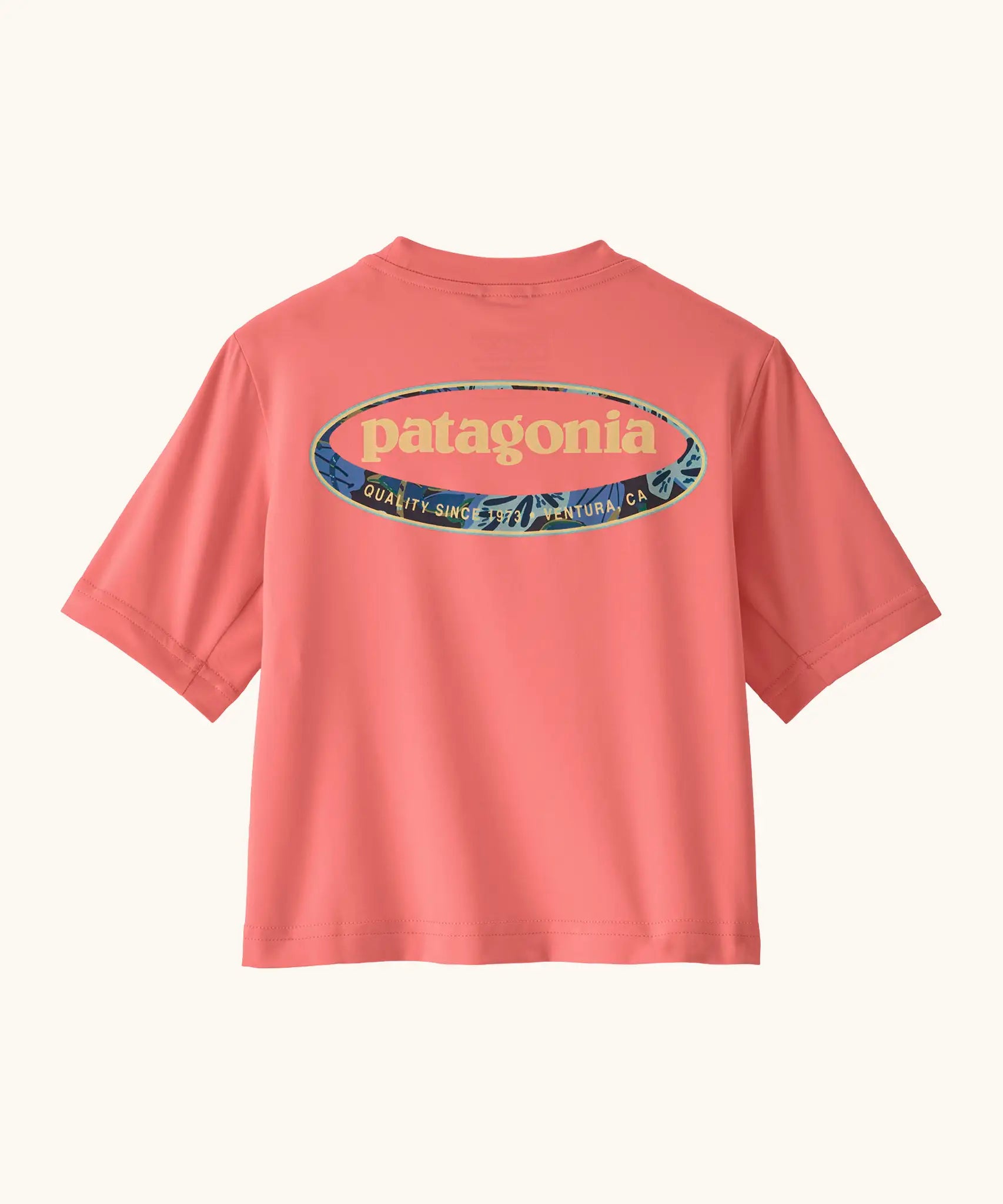 Patagonia's little kids capeline short sleeve t-shirt in bright pink with large oval logo graphic on upper back 