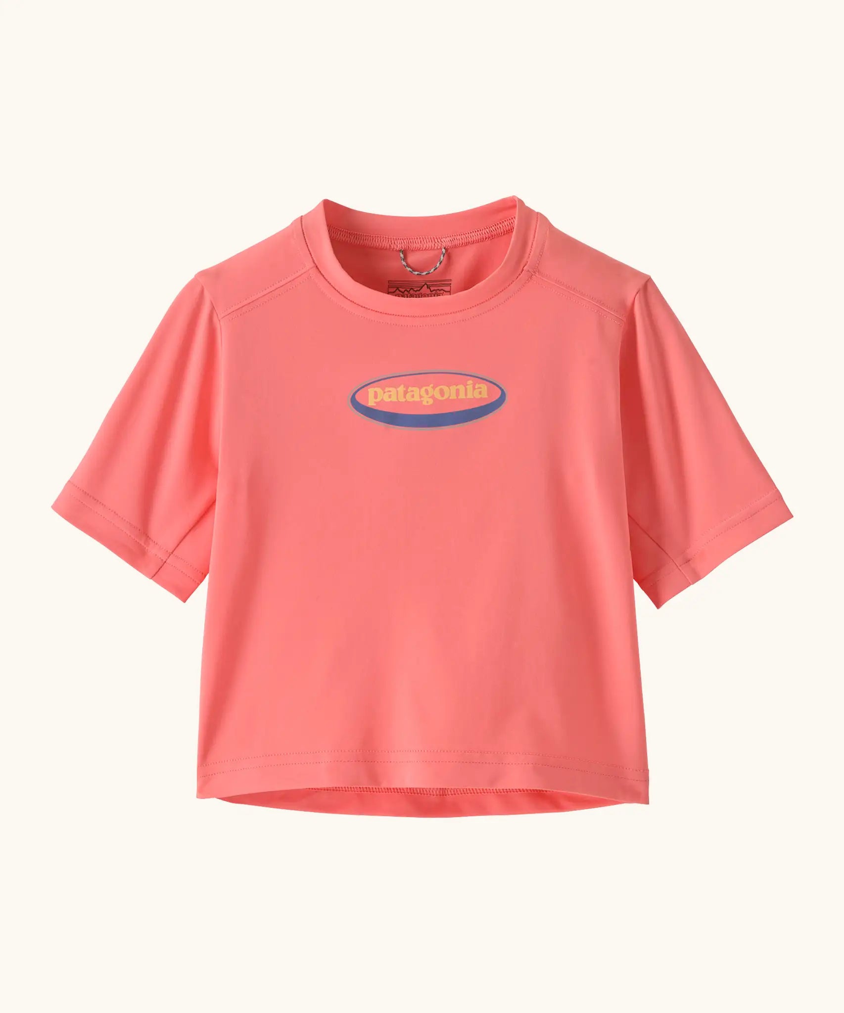 Patagonia's little kids capeline short sleeve t-shirt in bright pink with small oval logo graphic on upper body 
