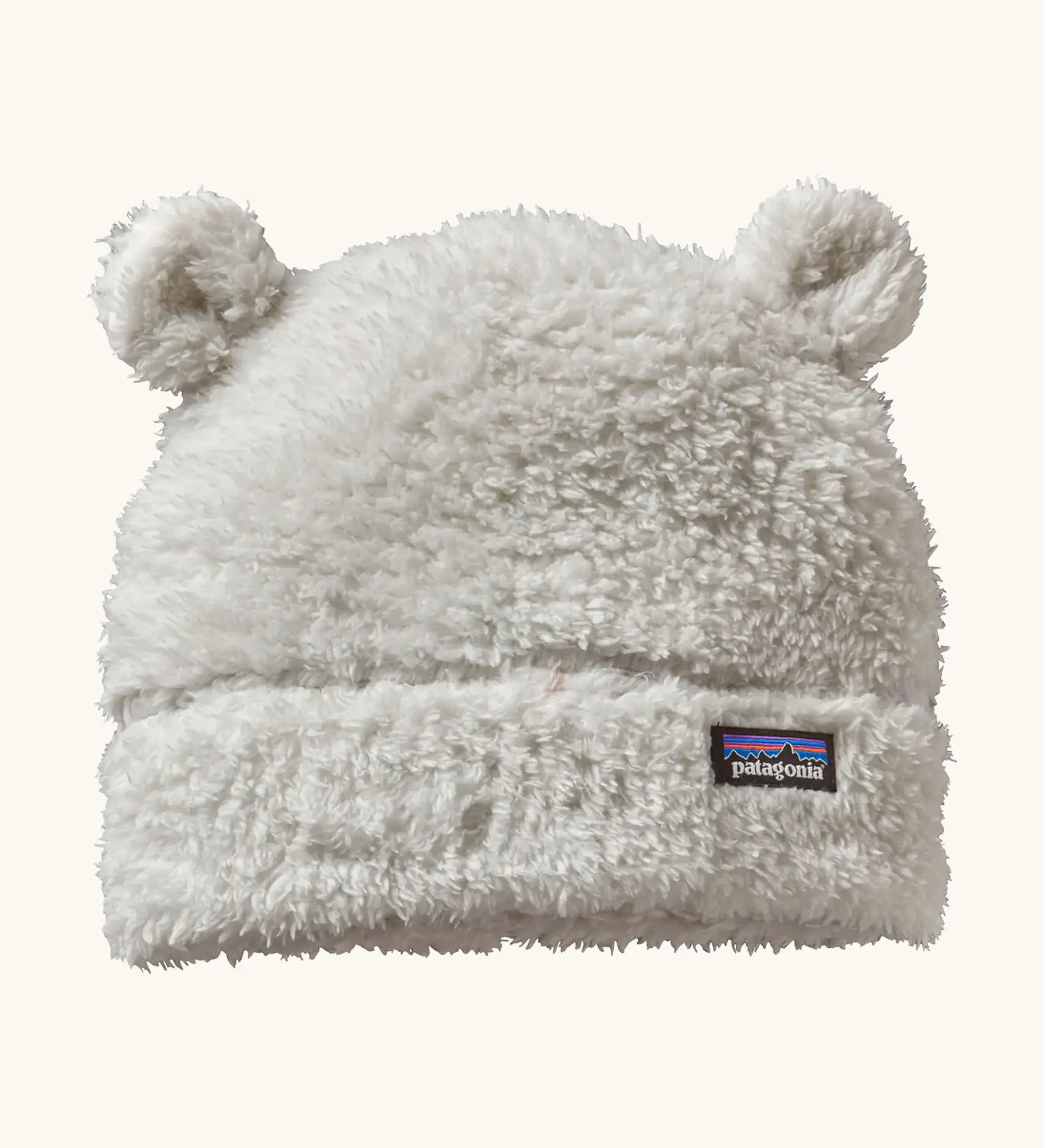Patagonia Baby Furry Friends Hat in birch white. Cream High pile fleece hat with little bear-cub ear panels