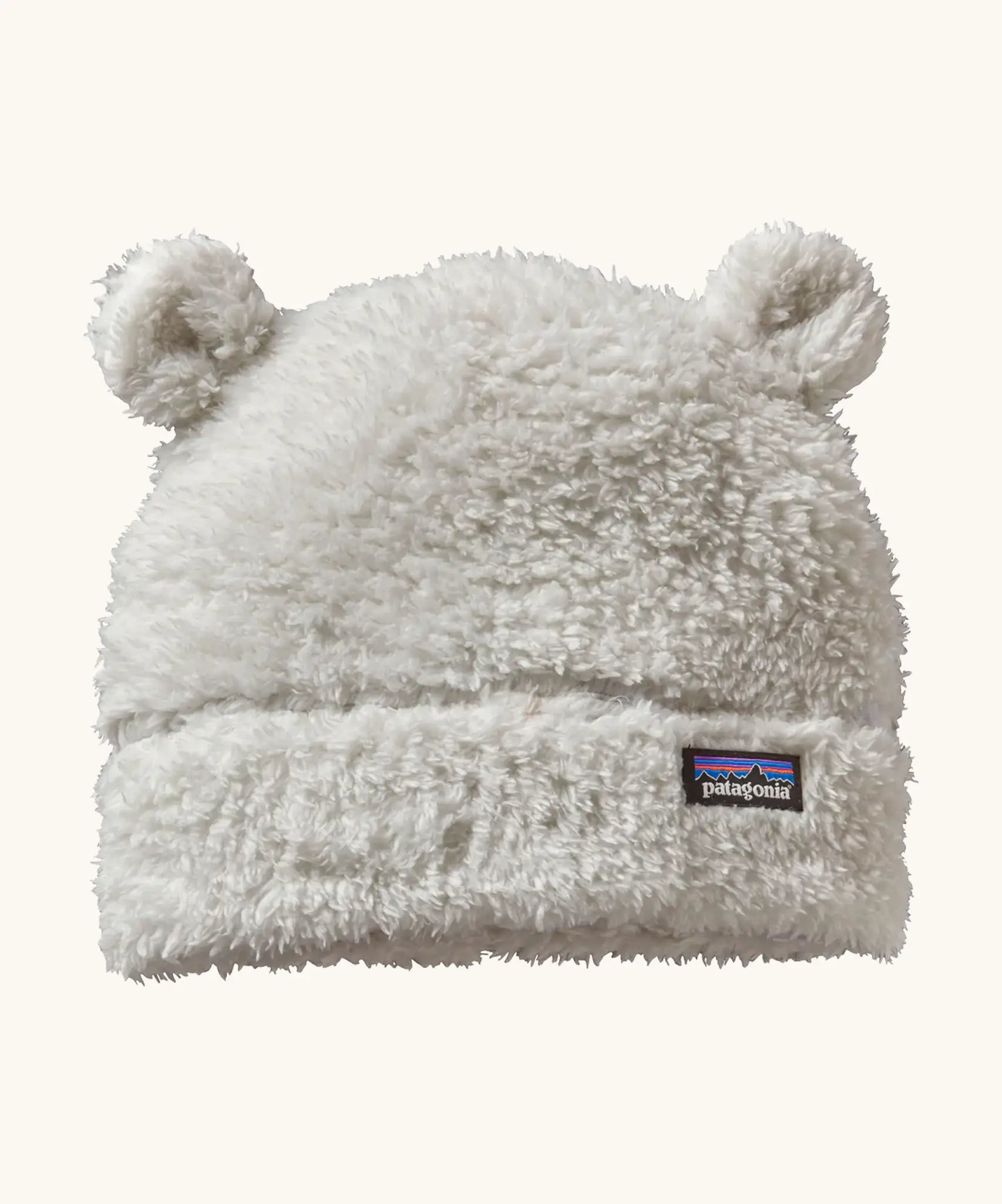 Patagonia Baby Furry Friends Hat in birch white. Cream High pile fleece hat with little bear-cub ear panels