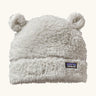 Patagonia Baby Furry Friends Hat in birch white. Cream High pile fleece hat with little bear-cub ear panels