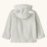 Patagonia baby furry friends hoody in birch white. The back of the soft high-pile recycled polyester fleece, the hood with the bear cub ears is down. 