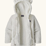 Patagonia Baby Furry Friends Hoody in Birch White. Fluffy textured fleece, unzipped to showcase the fluffy interior.