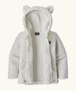 Patagonia Baby Furry Friends Hoody in Birch White. Fluffy textured fleece, unzipped to showcase the fluffy interior.
