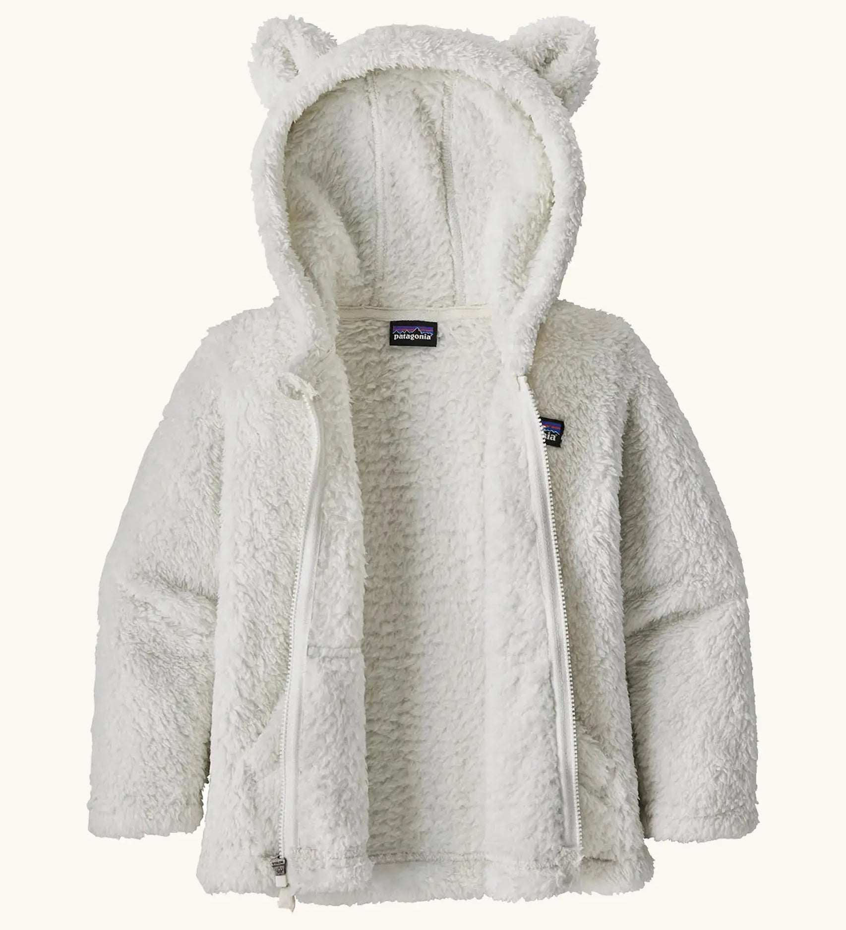 Patagonia Baby Furry Friends Hoody in Birch White. Fluffy textured fleece, unzipped to showcase the fluffy interior.