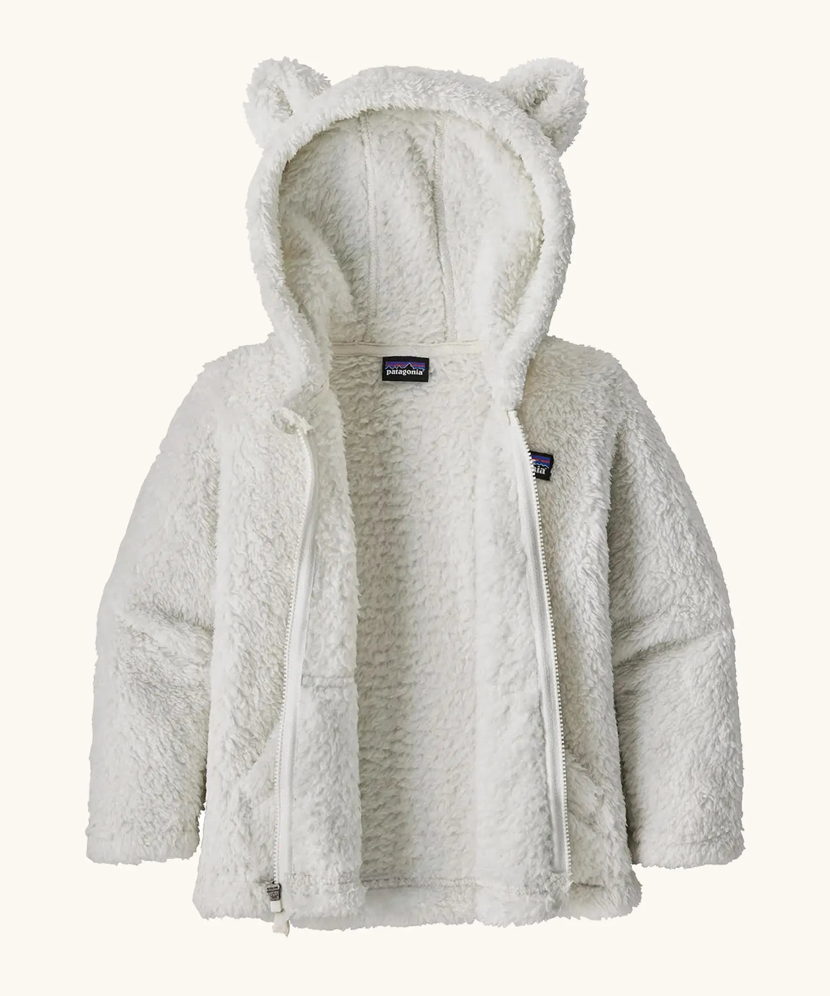 Patagonia Baby Furry Friends Hoody in Birch White. Fluffy textured fleece, unzipped to showcase the fluffy interior.