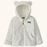 Patagonia Baby Furry Friends Hoody in birch white. Cream Fluffy hooded fleece with a full zip and pockets. Bear cub ears on the hood. Patagonia logo patch stitched on the front.