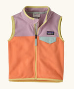 Patagonia baby micro d snap-t vest in pale orange with purple upper body. Shows full front zip and blue chest pocket