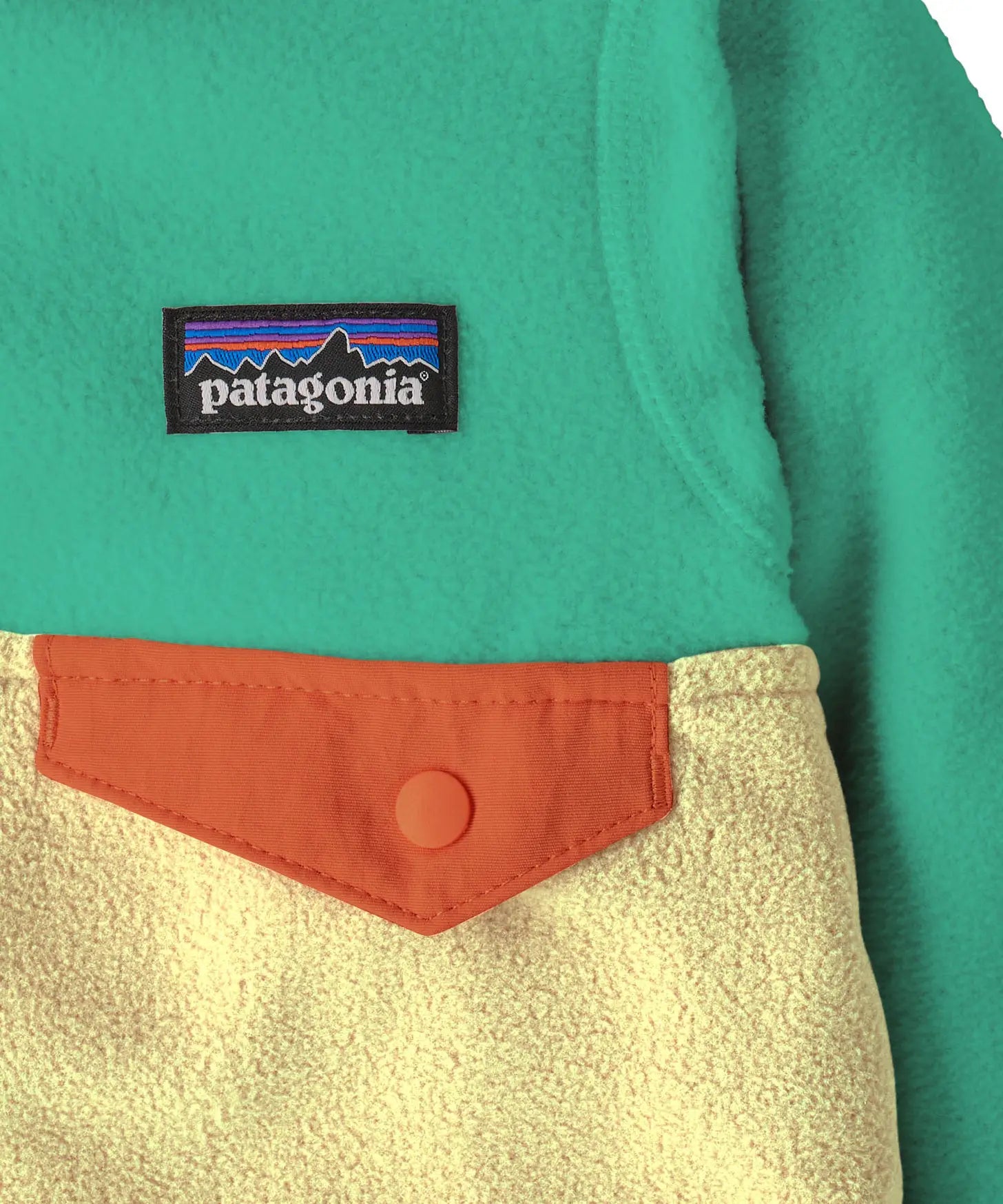 Close up of Patagonia little kids hooded micro d snap t jacket in yellow and green. Showing chest pocket with a green flap 