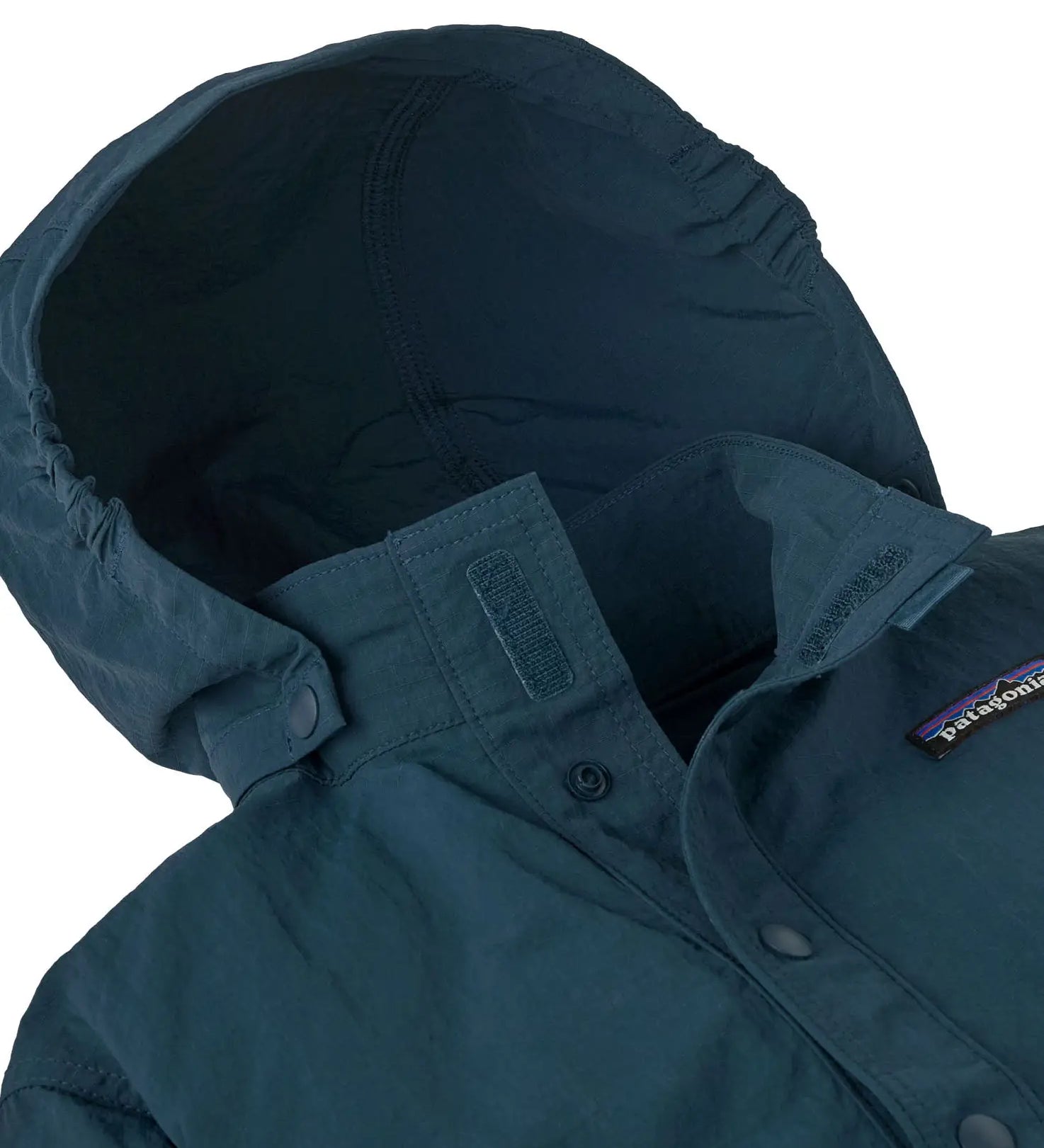 Close up of Patagonia's little kids recycled nylon outdoor everyday jacket in navy showing attached hood to collar