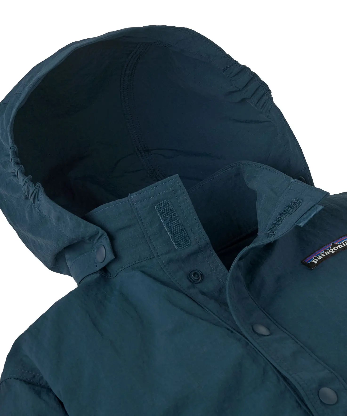 Close up of Patagonia's little kids recycled nylon outdoor everyday jacket in navy showing attached hood to collar