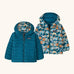 Patagonia baby reversible down hooded sweater jacket in glacial blue with a repeating playful seal design on the reverse. Features a full front zip and pockets