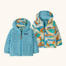 Patagonia baby reversible down hooded sweater jacket in bright blue with a abstract brushstroke design on the reverse. Features a full front zip and pockets
