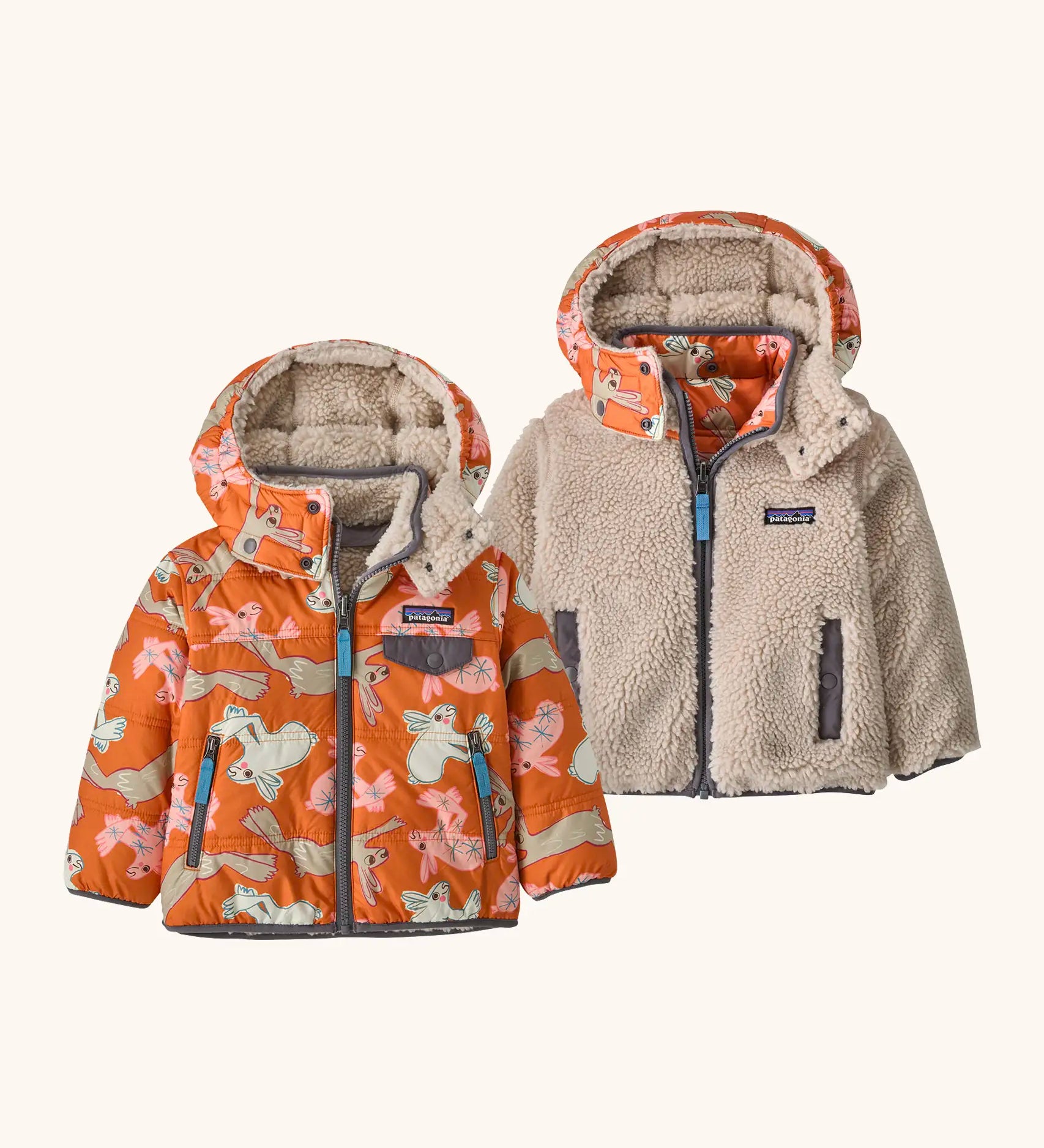 Patagonia reversible little kids tribbles hoody coat in orange with a repeating bunny design and fleece reverse. Features a small chest pocket and side pockets