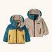 Patagonia reversible little kids tribbles hoody coat in teal and yellow lower half and fleece reverse. Features a small chest pocket and side pockets