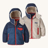 Patagonia reversible little kids tribbles hoody coat in blue with red trim and fleece reverse. Features a small chest pocket and side pockets