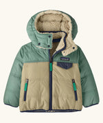 Patagonia reversible little kids tribbles hoody in sage green with a fleece inner for warmth. Features a removable hood, chest and side pockets