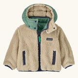 Patagonia reversible little kids tribbles hoody coat showing fleece alternative and removable hood, chest and side pockets.