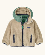 Patagonia reversible little kids tribbles hoody coat showing fleece alternative and removable hood, chest and side pockets.