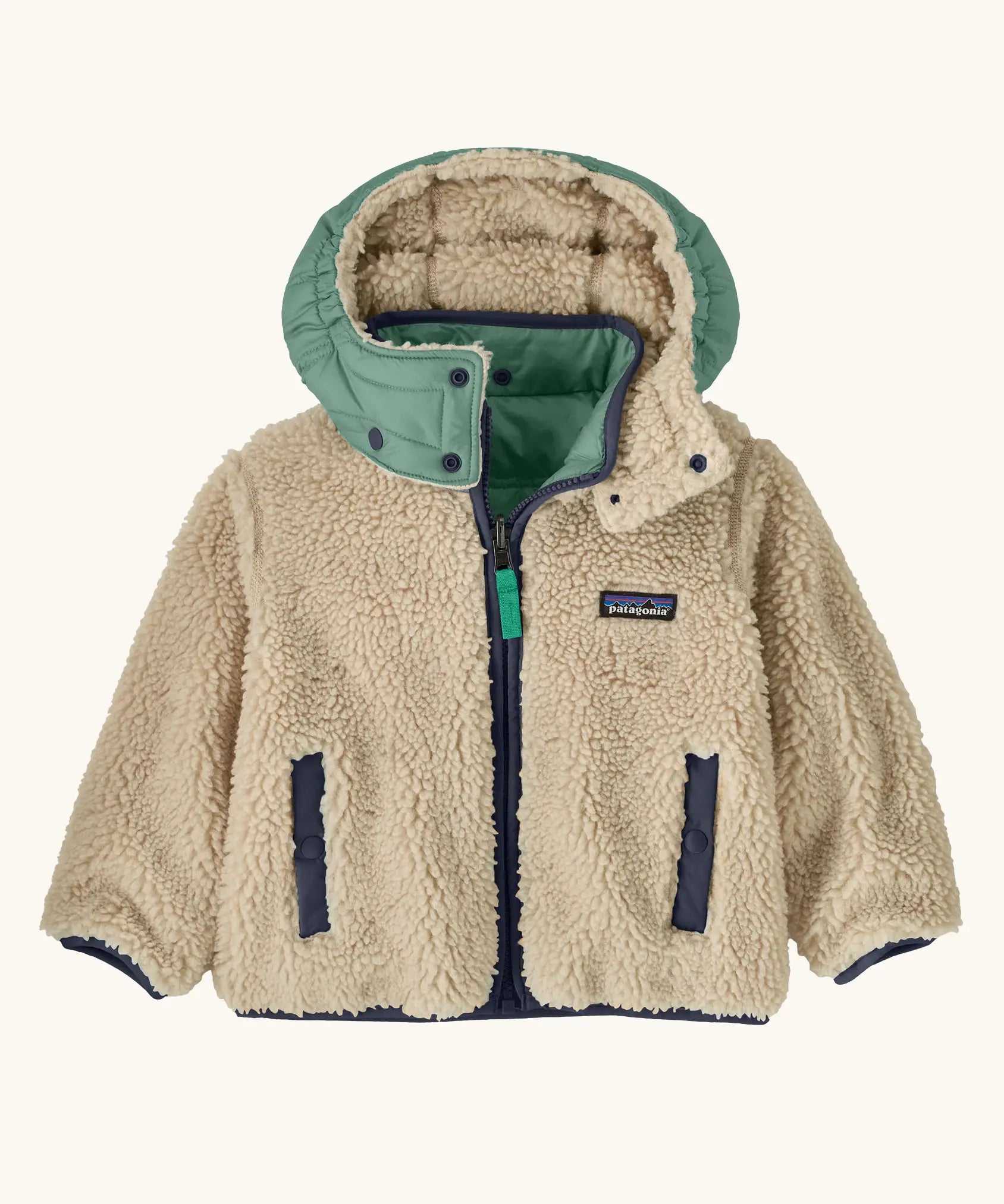 Patagonia reversible little kids tribbles hoody coat showing fleece alternative and removable hood, chest and side pockets.