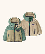 Patagonia reversible little kids tribbles hoody coat in sage green and stone lower half and fleece reverse. Features a small chest pocket and side pockets