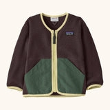 Patagonia baby fleece shearlings jacket in brown with yellow trim. Features a full length zip and green front pockets