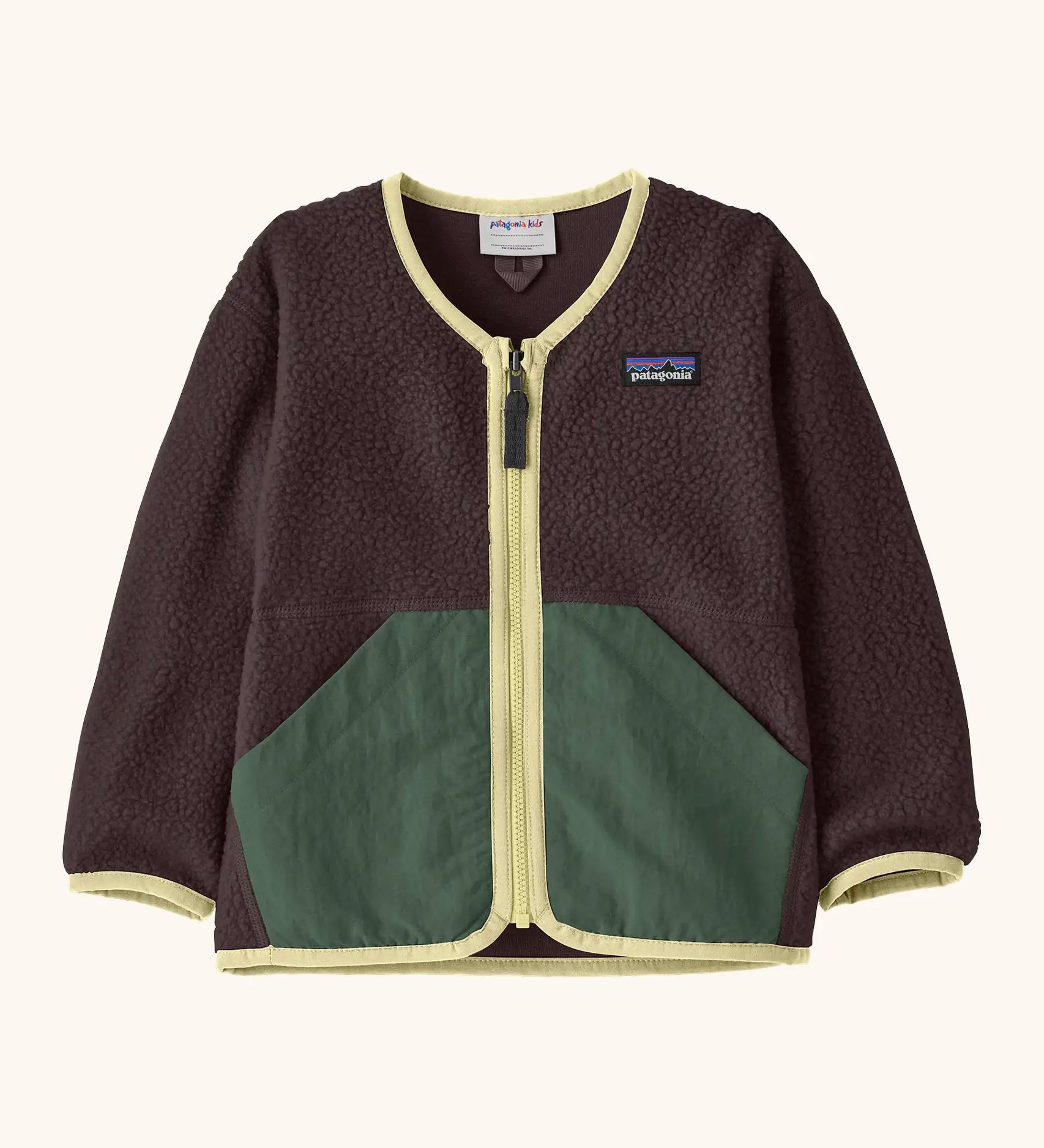 Patagonia baby fleece shearlings jacket in brown with yellow trim. Features a full length zip and green front pockets