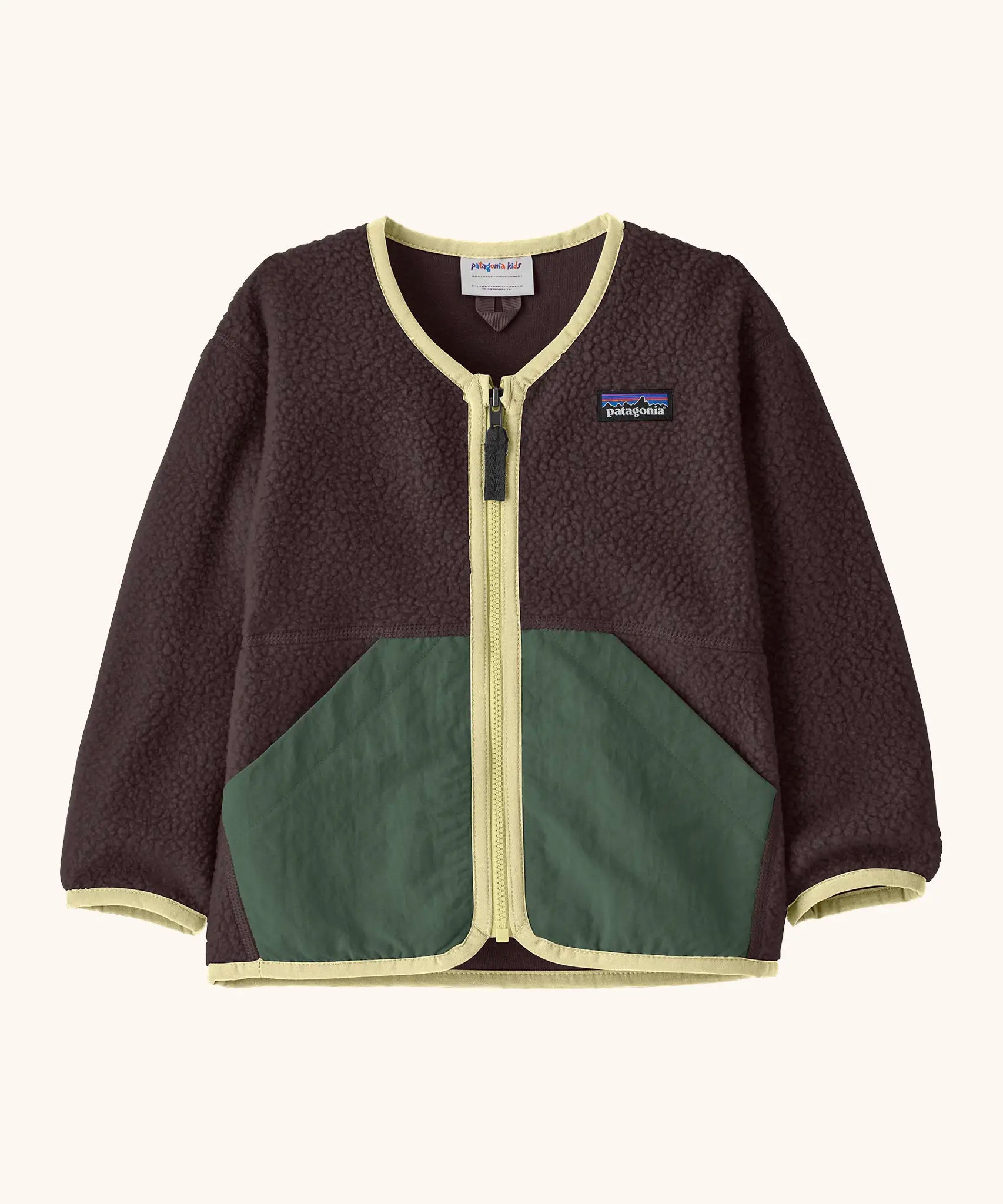Patagonia baby fleece shearlings jacket in brown with yellow trim. Features a full length zip and green front pockets