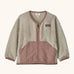 Patagonia baby fleece shearlings jacket in beige with pale pink trim. Features a full length zip and front pockets