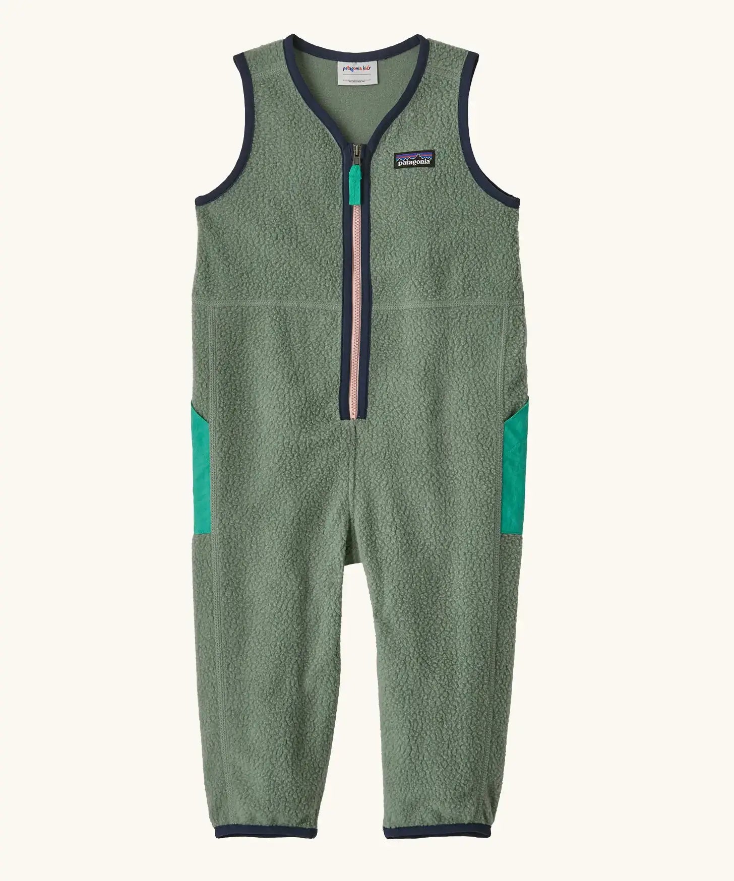 Patagonia baby fleeced shearlings overalls in green with navy trim. Features a half length zip and side pockets