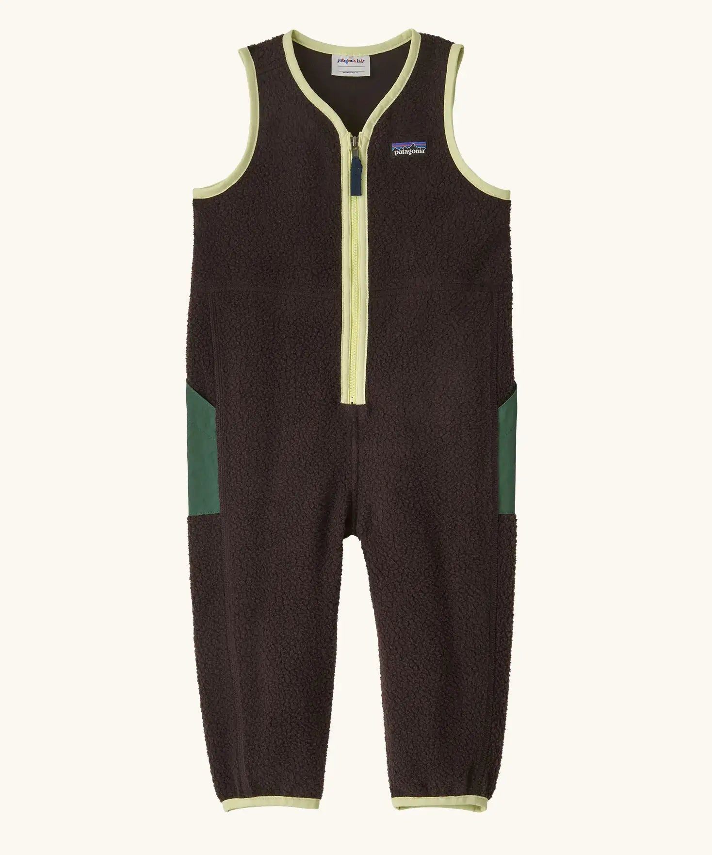 Patagonia baby fleeced shearlings overalls in brown with yellow trim. Features a half length zip and green side pockets