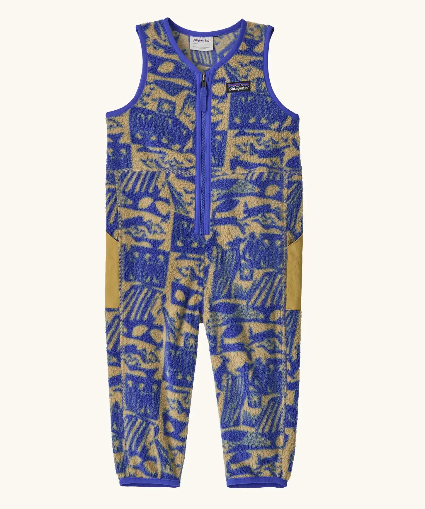 Patagonia baby fleeced shearlings overalls in blue with yellow abstract designs. Features a half length zip and side pockets