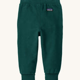The back of the Patagonia Baby Sweatpants in a dark Cascade Green colour available at Babipur. Features a brand patch and elasticated cuffs.