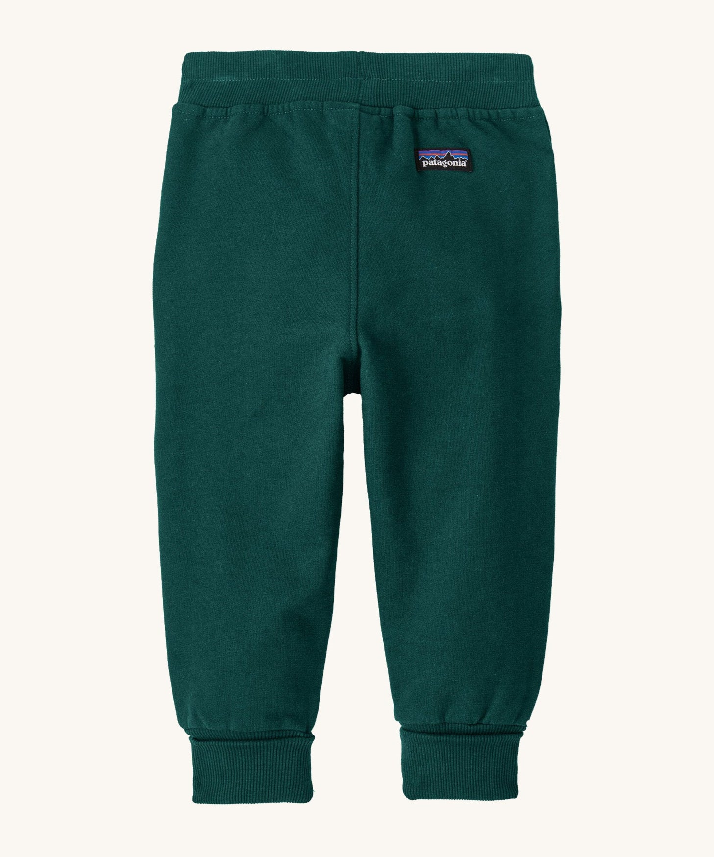 The back of the Patagonia Baby Sweatpants in a dark Cascade Green colour available at Babipur. Features a brand patch and elasticated cuffs.