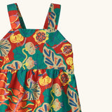 Shoulder straps on Patagonia's little kids tidal thread sleeveless dress in red with repeating abstract tropical pattern