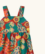 Shoulder straps on Patagonia's little kids tidal thread sleeveless dress in red with repeating abstract tropical pattern