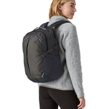 A person wearing the Patagonia Refugio Day Pack 26L  Smolder Blue