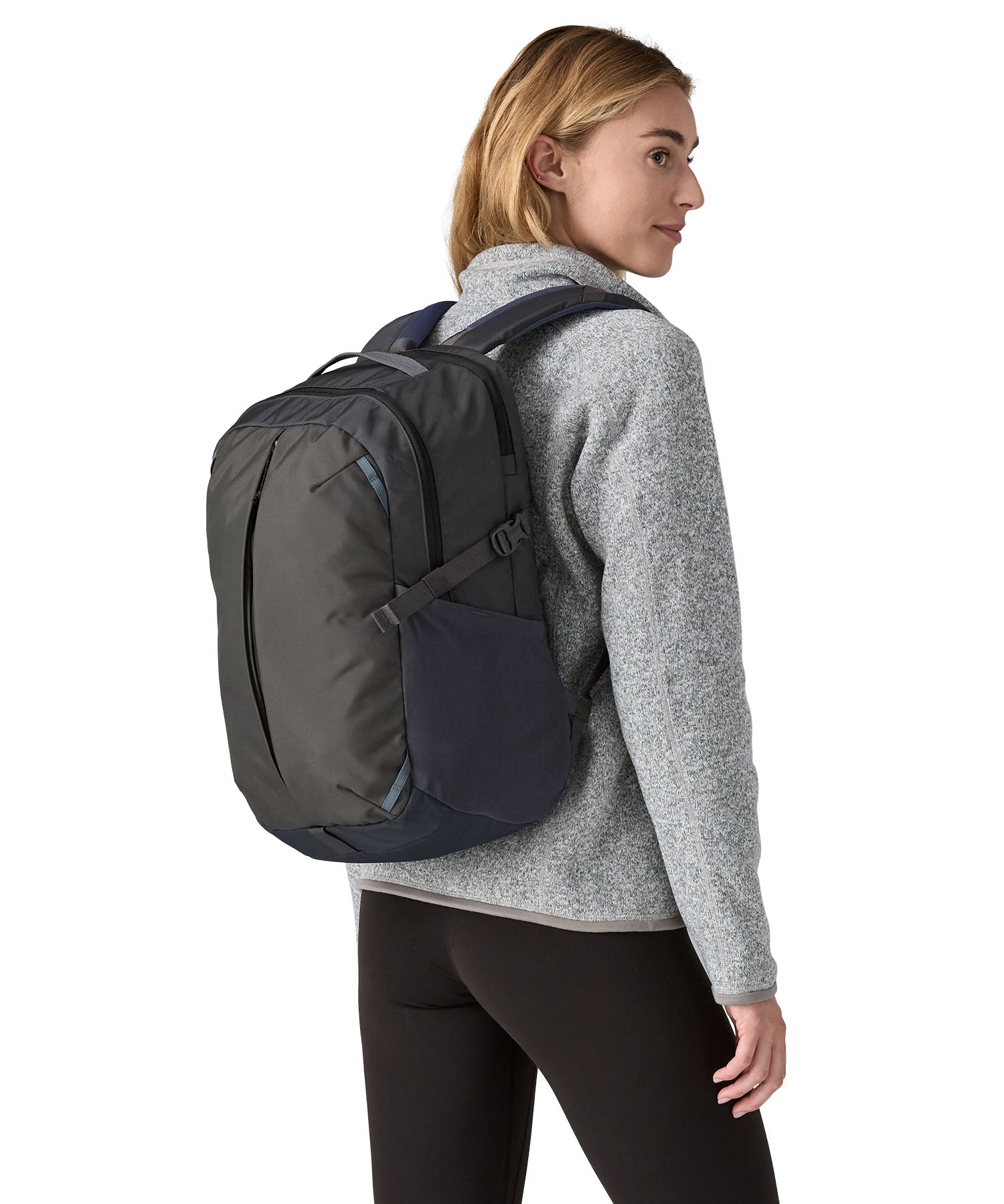 A person wearing the Patagonia Refugio Day Pack 26L  Smolder Blue