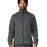 A man wearing the Patagonia men's better sweater in woven together/sunken blue design available at Babipur. A green and blue with a pattern lightweight fleece style jacket with full length zip, 2 side pockets, a chest pocket and features the brand logo patch stitched on the left chest 