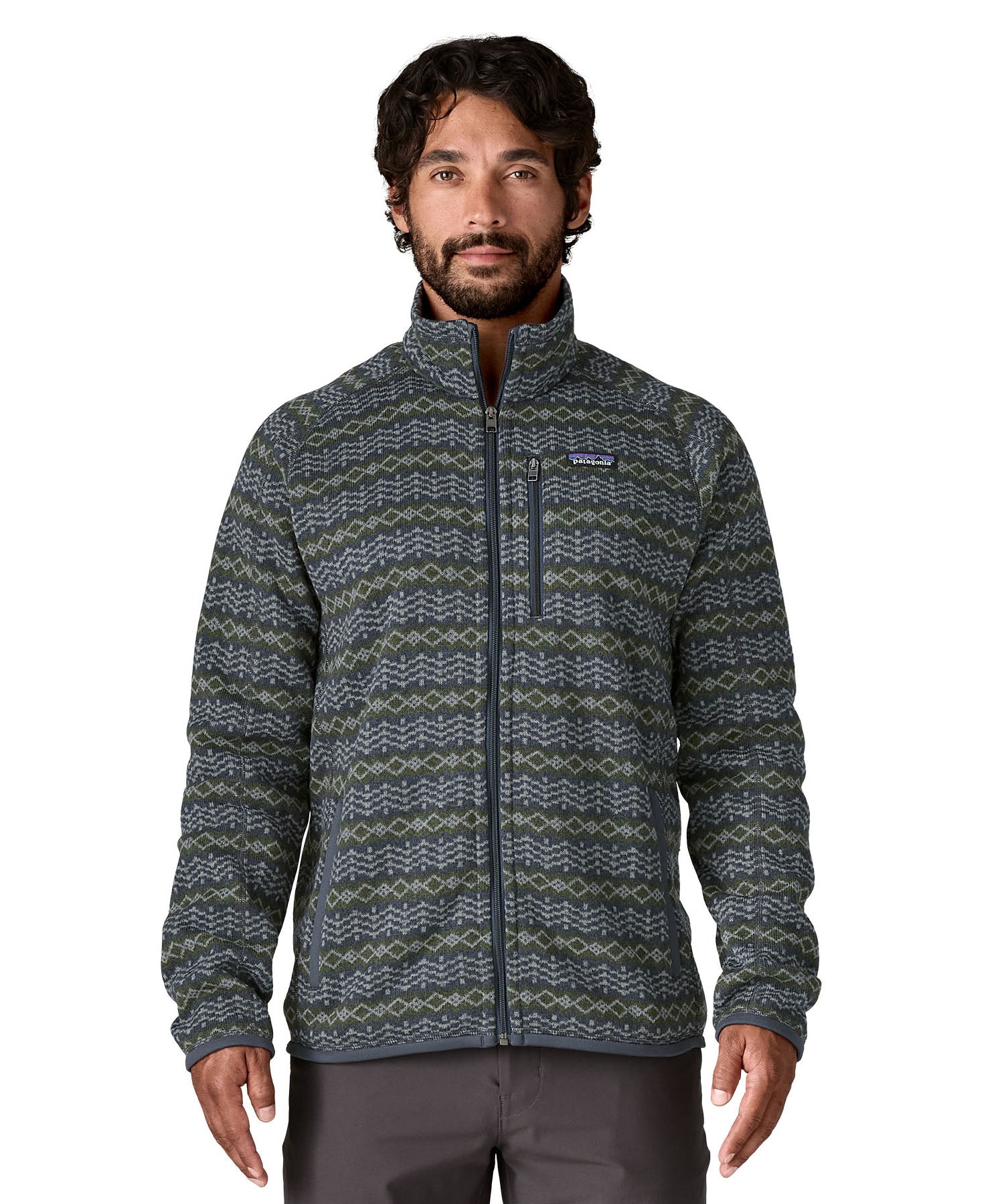 A man wearing the Patagonia men's better sweater in woven together/sunken blue design available at Babipur. A green and blue with a pattern lightweight fleece style jacket with full length zip, 2 side pockets, a chest pocket and features the brand logo patch stitched on the left chest 
