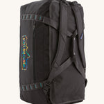 The Patagonia Black Hole Duffel 70L Ink Black upright, showing the carry handles and shoulder straps