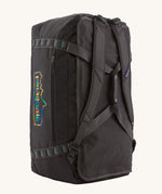 The Patagonia Black Hole Duffel 70L Ink Black upright, showing the carry handles and shoulder straps