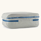 Underside of the Patagonia black hole 14 litre cube bag in light grey showing the blue zip running underneath 