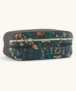 Underside of the Patagonia black hole 14 litre cube bag in black with abstract pattern showing zip running underneath 