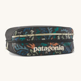 Patagonia black hole 14 litre cube bag in black with abstract pattern design, black zip detail and cream brand text logo on front
