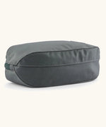 Underside of Patagonia black hole cube 3 litre bag in black in grey
