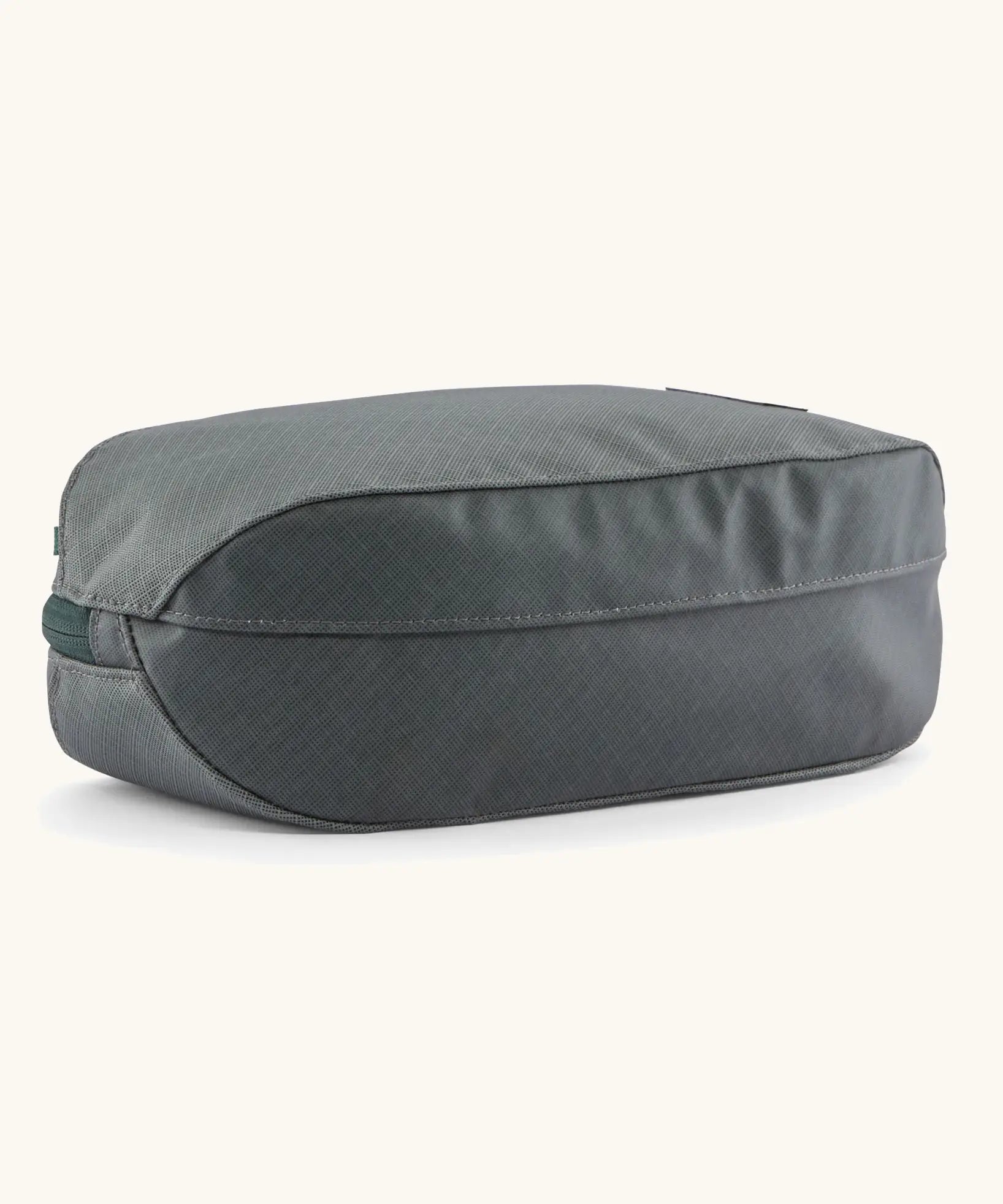 Underside of Patagonia black hole cube 3 litre bag in black in grey