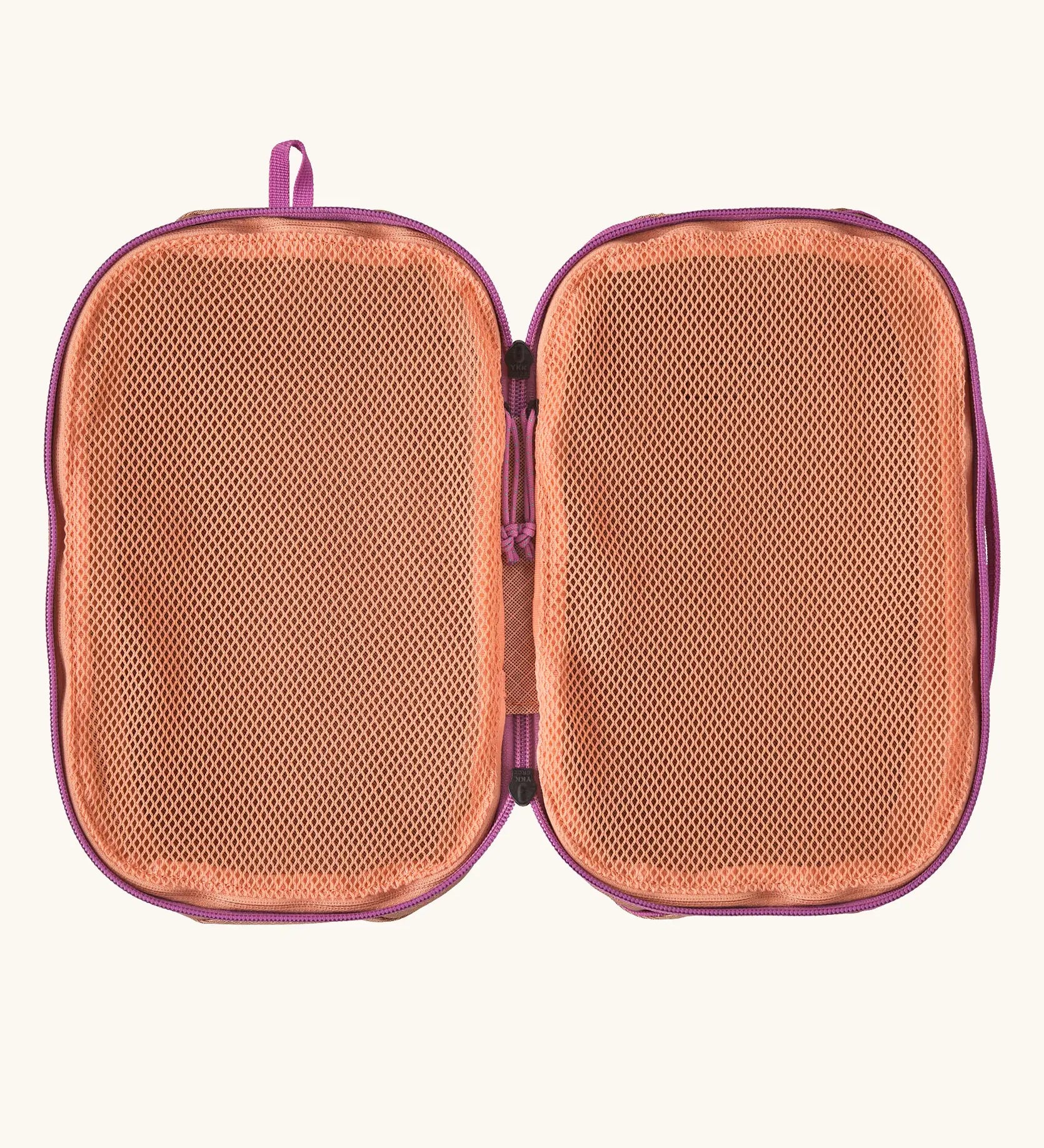 Inside of Patagonia black hole 6 litre cube bag in orange showing 2 separate meshed compartments 