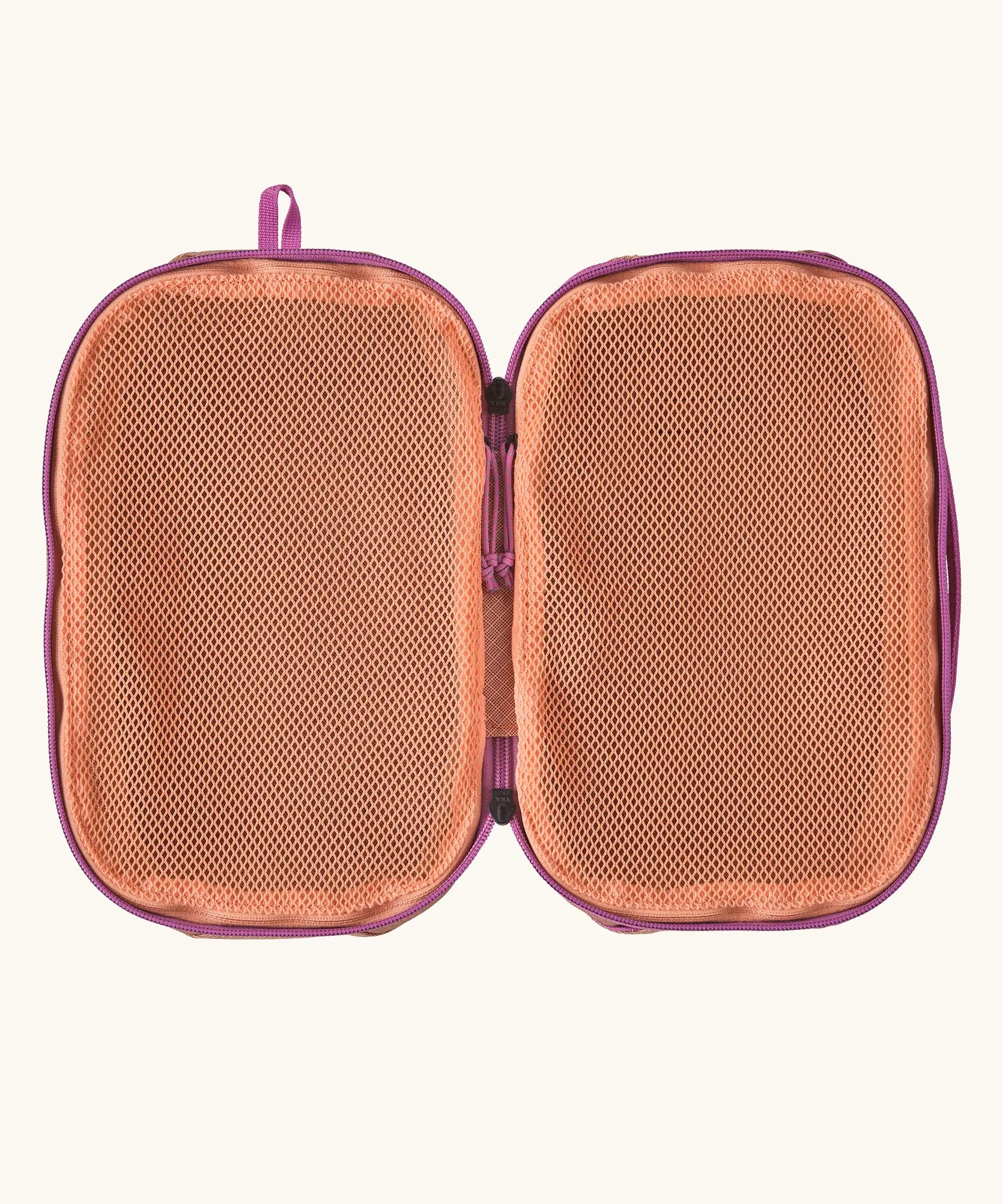 Inside of Patagonia black hole 6 litre cube bag in orange showing 2 separate meshed compartments 
